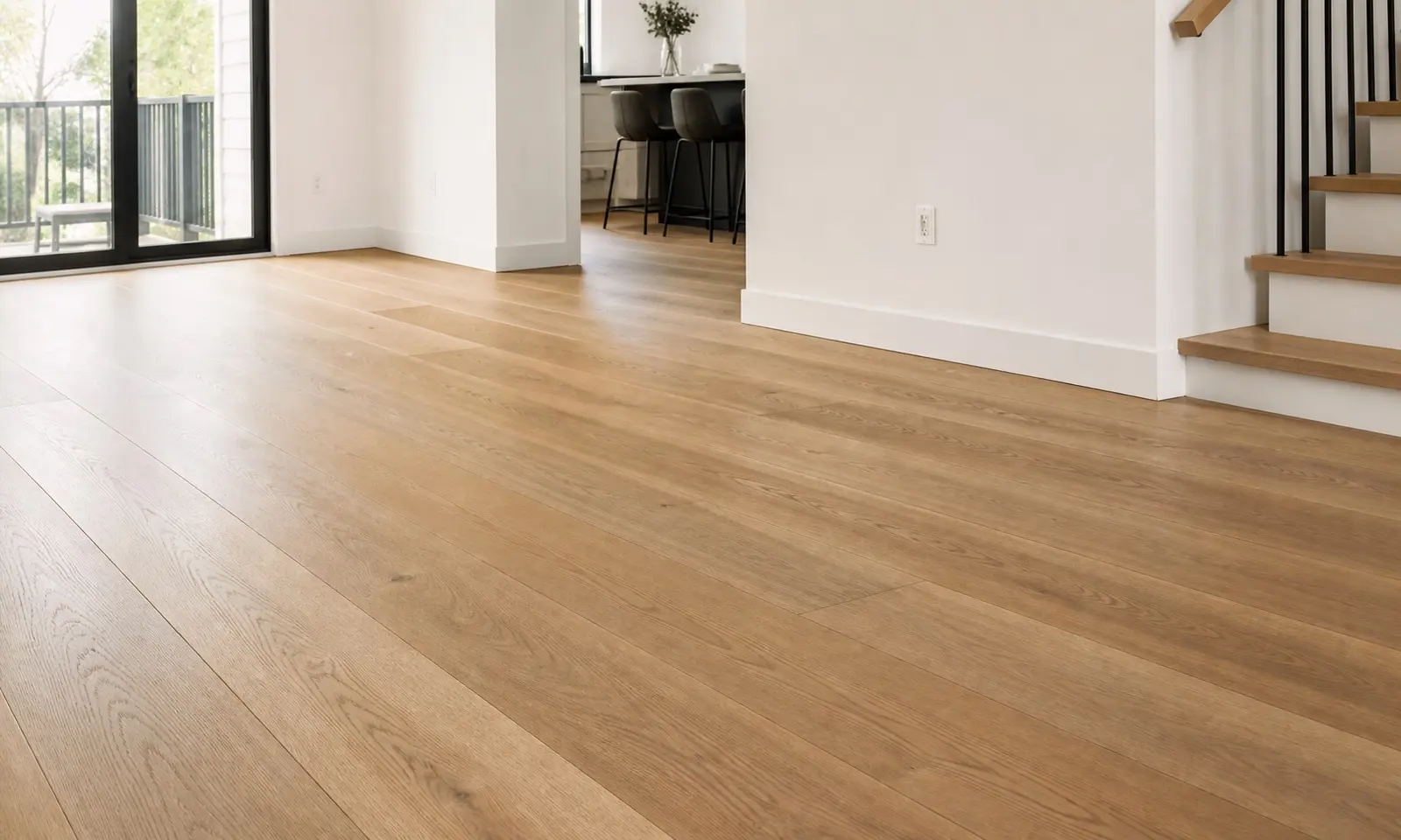 Newly installed white oak hardwood floor running through an empty Toronto living room