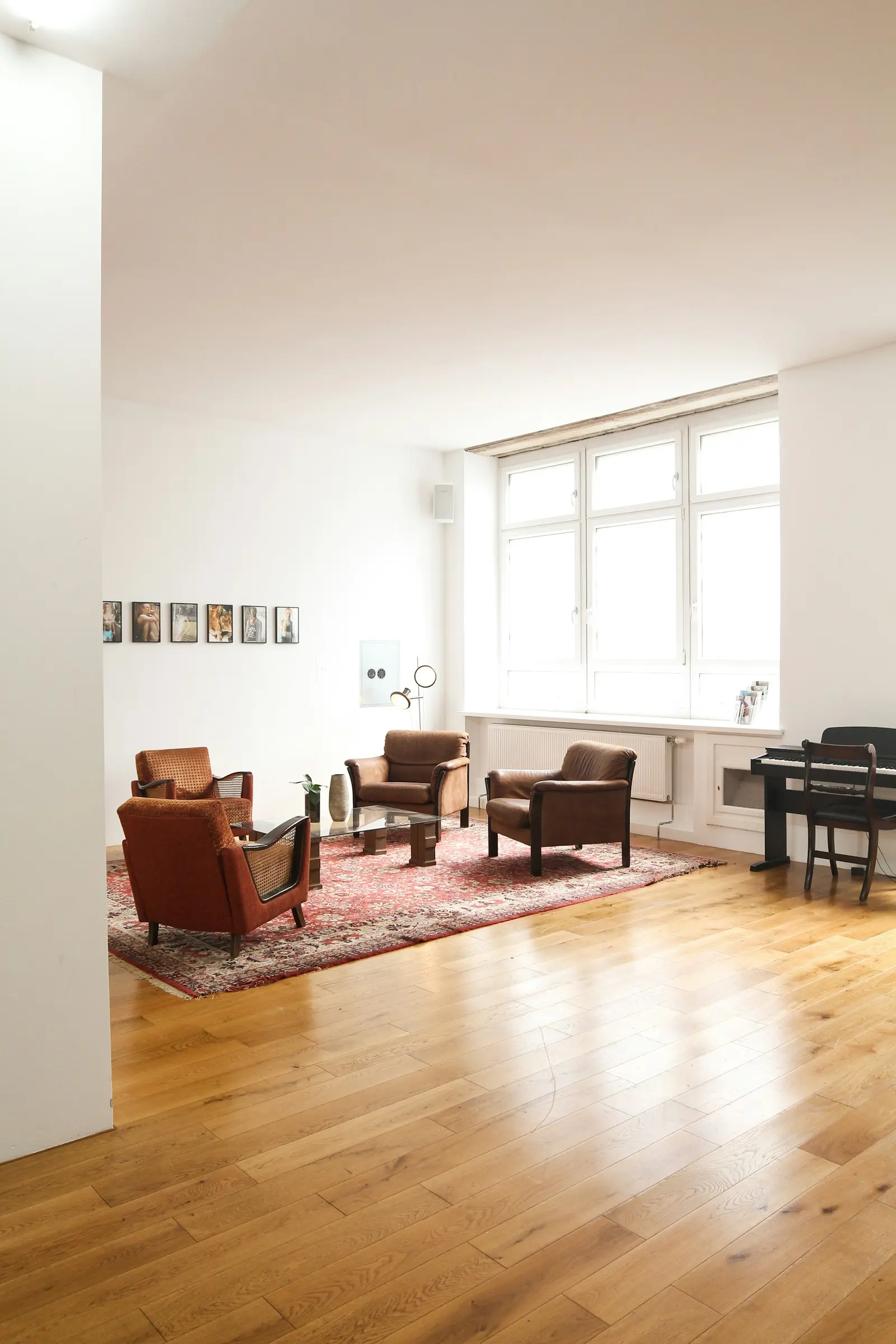 Refinished hardwood floor in a Toronto living room with warm red-brown tone