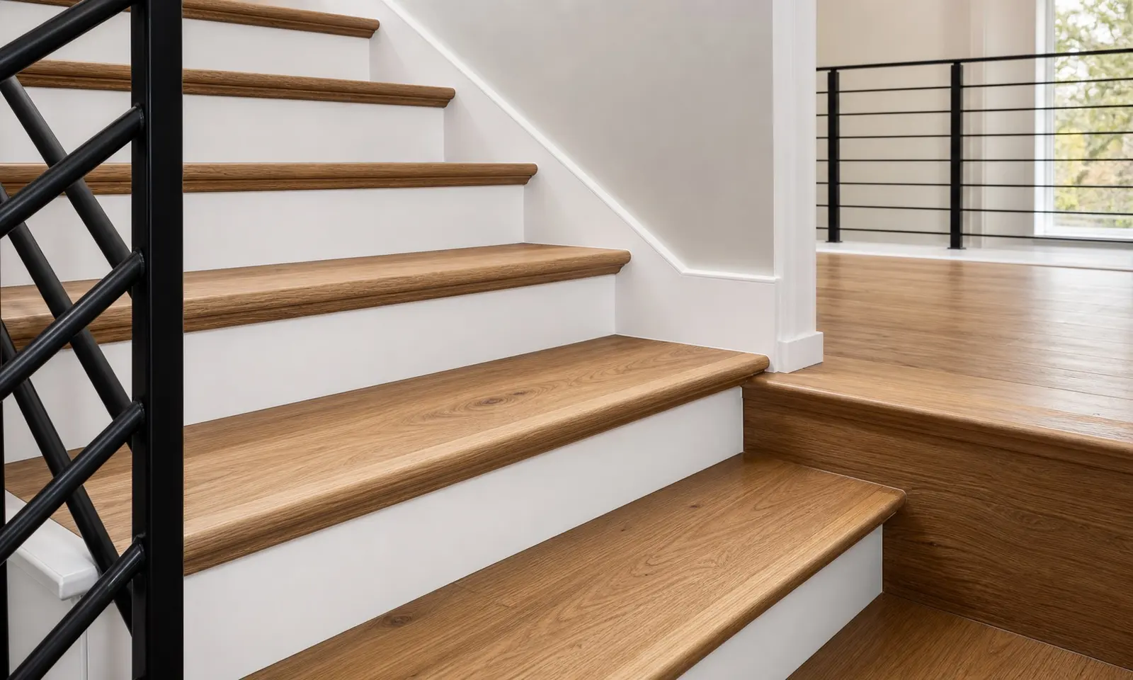 Staircase with refinished oak treads and painted white risers in a Toronto home